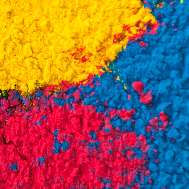 Close-up of colorful powder in yellow, blue, and red.