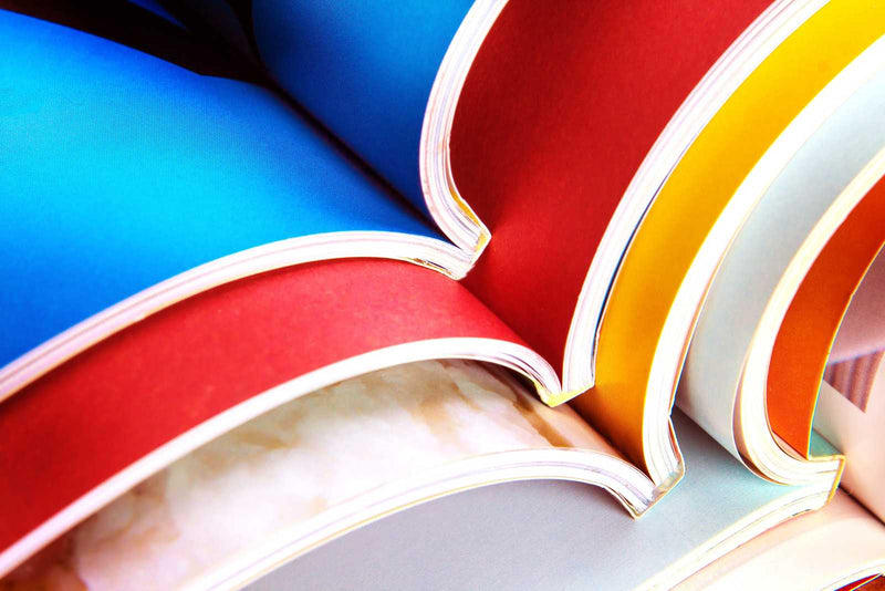 Colorful printed books, Uproar design & Print High Chroma Digital Press cover photo